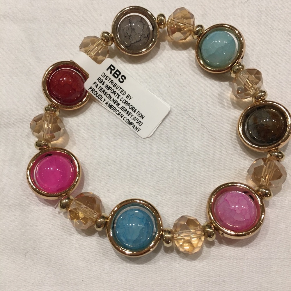 Bracelet multi colored trimmed in gold ton…